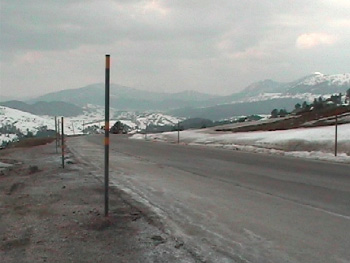 Taller snow poles line the sides of the roads